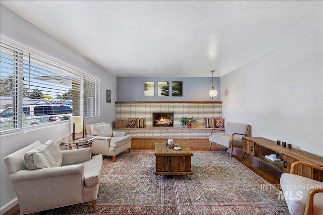 539 Rimview Dr, Twin Falls, ID 83301 - living area featuring plenty of natural light, a fireplace, and wood finished floors
