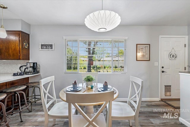 539 Rimview Dr, Twin Falls, ID 83301 - dining space featuring light wood-type flooring and baseboards