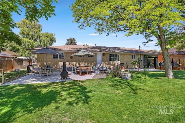 539 Rimview Dr, Twin Falls, ID 83301 - rear view of property featuring a patio and brick siding