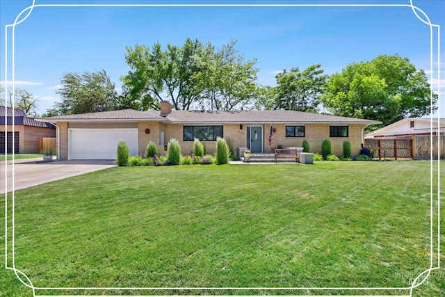 539 Rimview Dr, Twin Falls, ID 83301 - single story home with a garage, driveway, brick siding, and a chimney