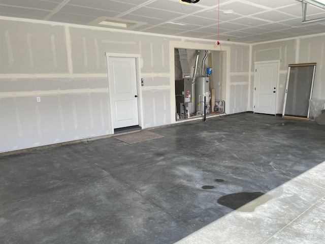 garage featuring gas water heater and heating unit