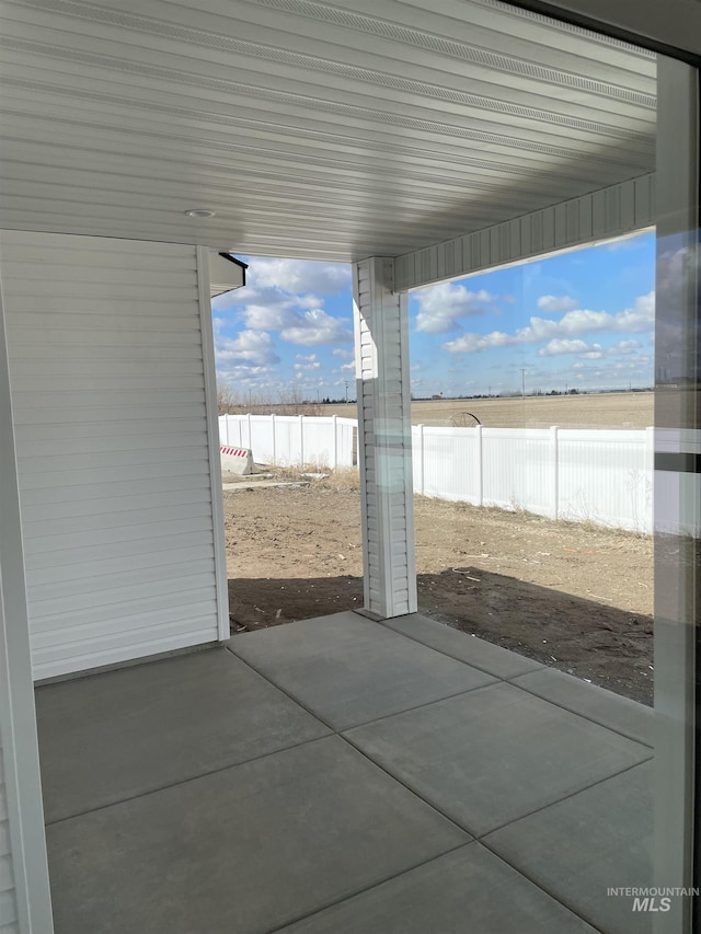 view of patio / terrace featuring fence