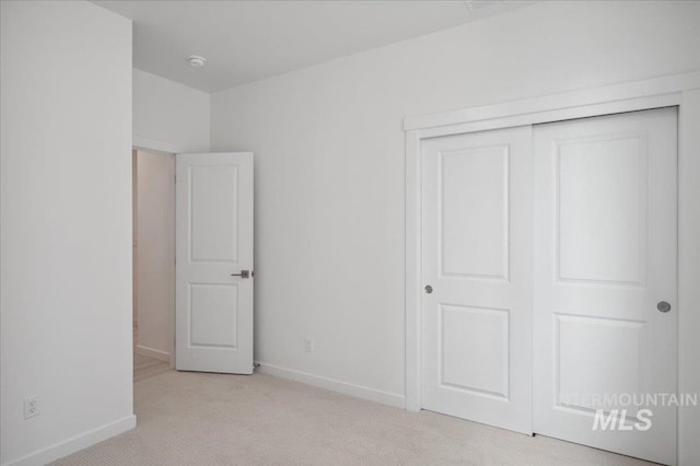 5485 N Patimos Ave, Meridian, ID 83646 - unfurnished bedroom featuring baseboards, carpet, and a closet