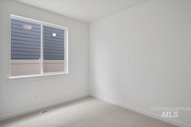 5485 N Patimos Ave, Meridian, ID 83646 - carpeted spare room featuring baseboards and visible vents
