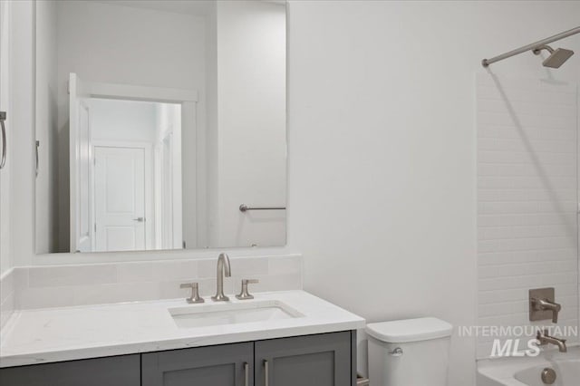 5485 N Patimos Ave, Meridian, ID 83646 - bathroom featuring vanity, toilet, and shower / washtub combination