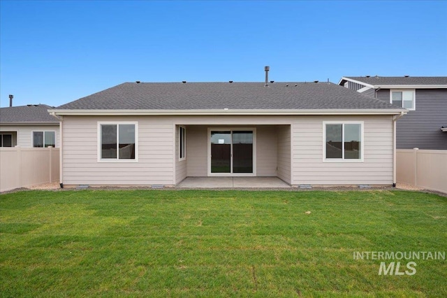 5485 N Patimos Ave, Meridian, ID 83646 - back of house with a fenced backyard, a patio, and a yard