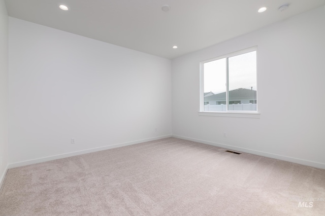 5485 N Patimos Ave, Meridian, ID 83646 - empty room featuring visible vents, recessed lighting, baseboards, and light carpet