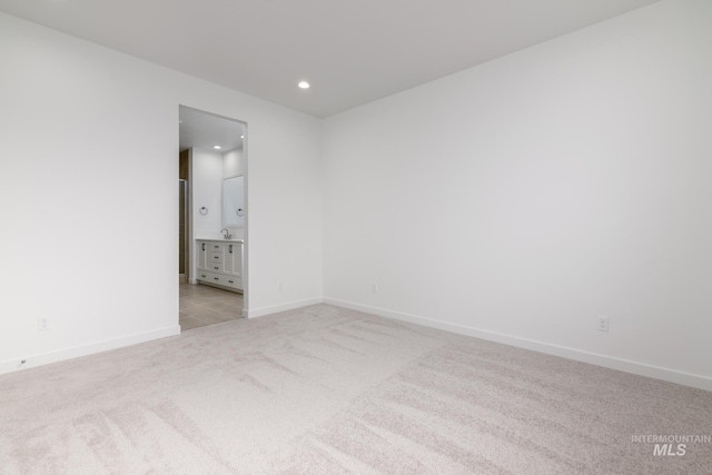 5485 N Patimos Ave, Meridian, ID 83646 - spare room with baseboards, recessed lighting, and light colored carpet