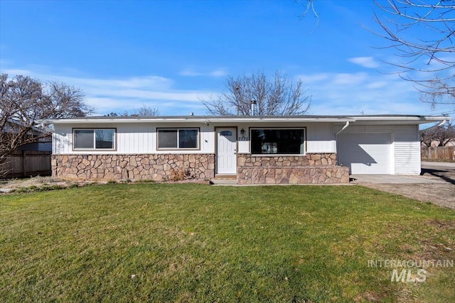 7770 W Cummins, Boise, ID 83709 - ranch-style home with stone siding, an attached garage, and driveway
