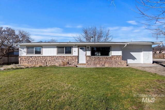 ranch-style house with a garage, fence, stone siding, driveway, and a front yard