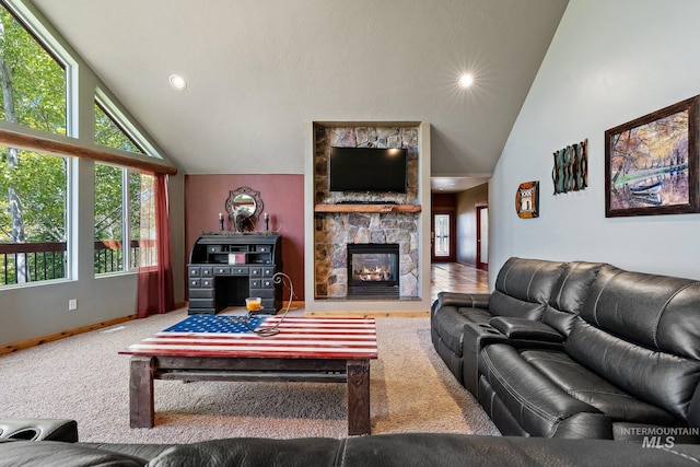 carpeted living room featuring high vaulted ceiling and a fireplace