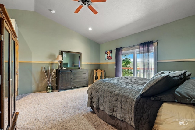 carpeted bedroom with ceiling fan, access to outside, and vaulted ceiling