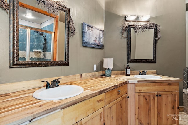 bathroom featuring vanity and an enclosed shower