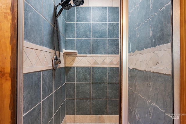 bathroom with tiled shower