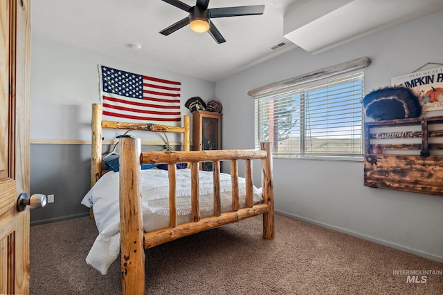 bedroom featuring dark colored carpet and ceiling fan