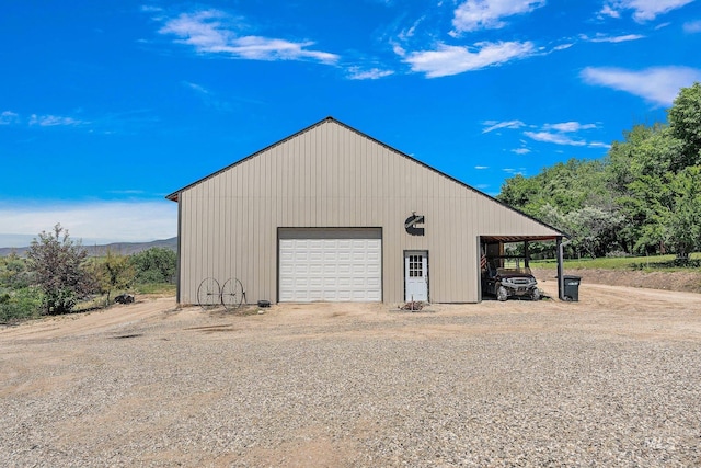 garage featuring a carport