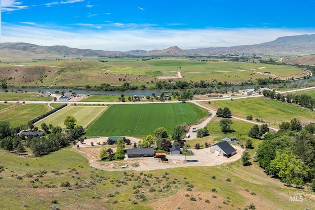 birds eye view of property with a rural view and a water and mountain view