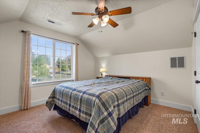 bedroom with visible vents, baseboards, and vaulted ceiling