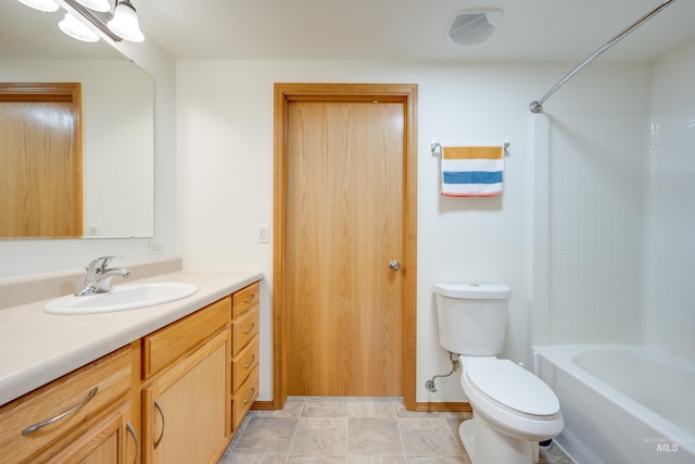 bathroom featuring shower / bath combination, toilet, and vanity