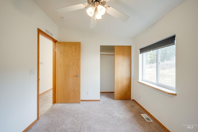 unfurnished bedroom featuring visible vents, baseboards, a closet, and carpet flooring