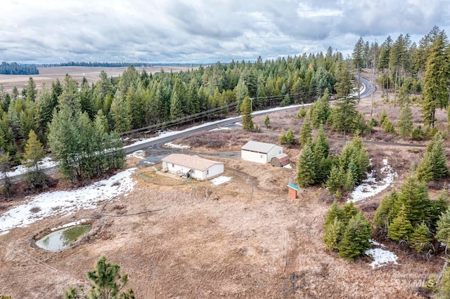 aerial view with a rural view and a wooded view