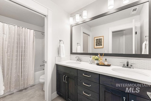 2251 N Garnet Creek Ave, Star, ID 83669 - full bath with toilet, double vanity, tasteful backsplash, and shower / bath combination with curtain