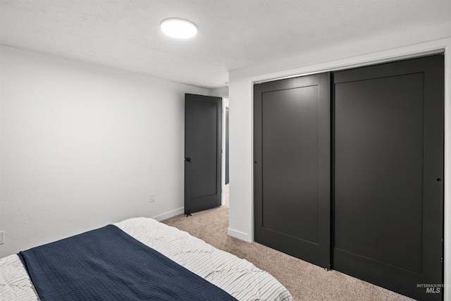 905 E 2nd St, Emmett, ID 83617 - bedroom with light colored carpet and a closet