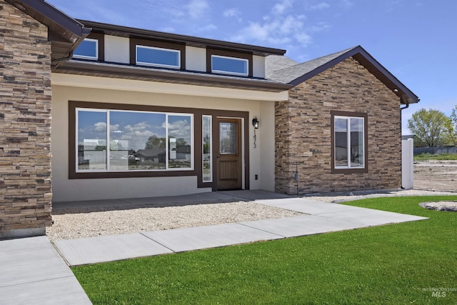 1442 Haizlee Way, Twin Falls, ID 83301 - entrance to property with stucco siding, a lawn, and stone siding