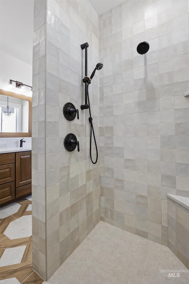 1442 Haizlee Way, Twin Falls, ID 83301 - full bath with tiled shower, vanity, and a chandelier