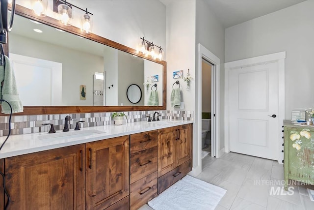 12457 W Superior St, Star, ID 83669 - full bath with a sink, backsplash, and toilet