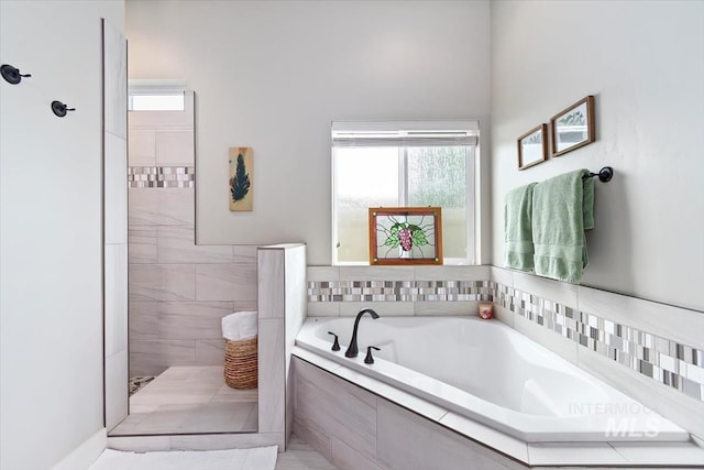 12457 W Superior St, Star, ID 83669 - full bath featuring a tile shower and a bath