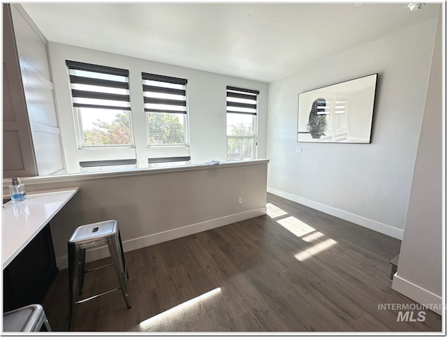 1514 W River St Unit 207, Boise, ID 83702 - interior space with dark wood finished floors and baseboards