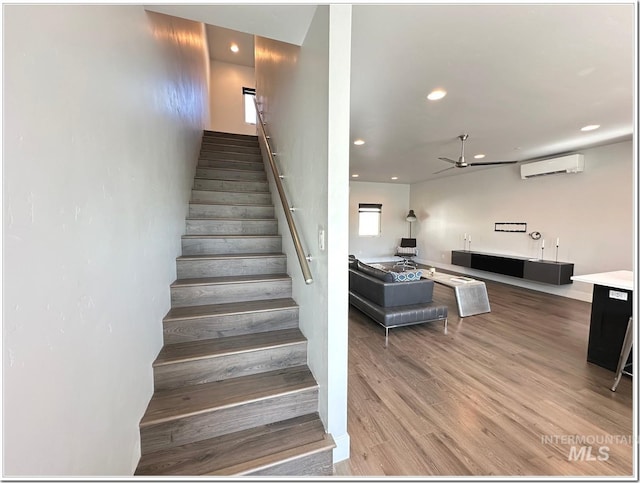 1514 W River St Unit 207, Boise, ID 83702 - stairway featuring a ceiling fan, a wall mounted AC, recessed lighting, and wood finished floors