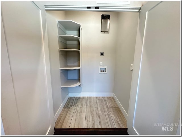 1514 W River St Unit 207, Boise, ID 83702 - washroom with wood finished floors, electric dryer hookup, washer hookup, and baseboards