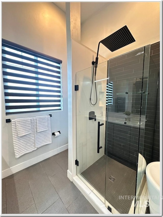 1514 W River St Unit 207, Boise, ID 83702 - full bath featuring a shower stall and baseboards
