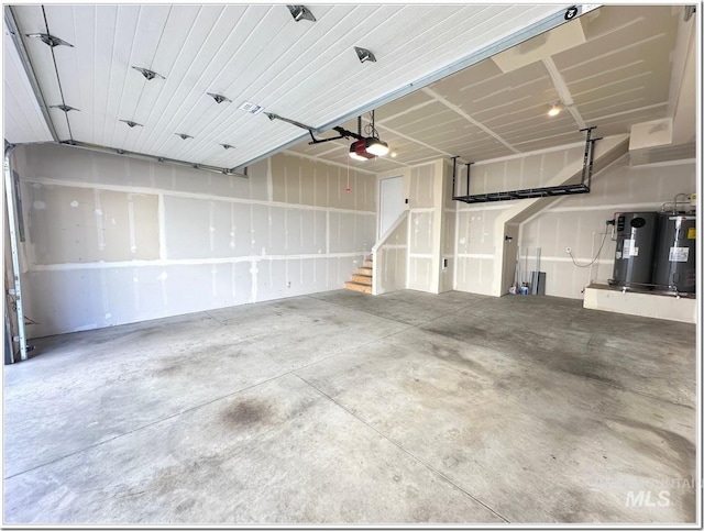 1514 W River St Unit 207, Boise, ID 83702 - garage with a garage door opener and water heater