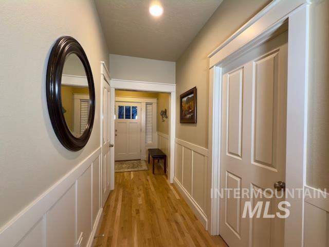 hall with light hardwood / wood-style flooring