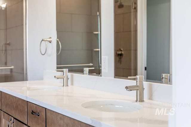 full bath featuring a sink and double vanity