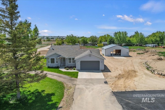 7267 Bowmont Rd, Nampa, ID 83686 - single story home with driveway, an attached garage, an outbuilding, and a front lawn