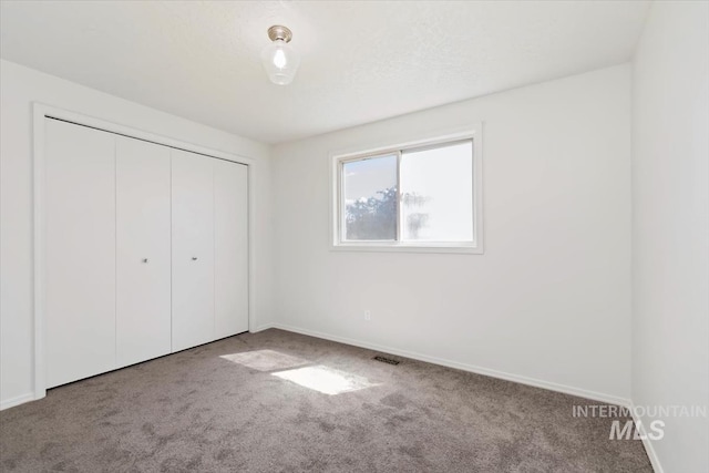 7267 Bowmont Rd, Nampa, ID 83686 - unfurnished bedroom with carpet flooring, a closet, and baseboards