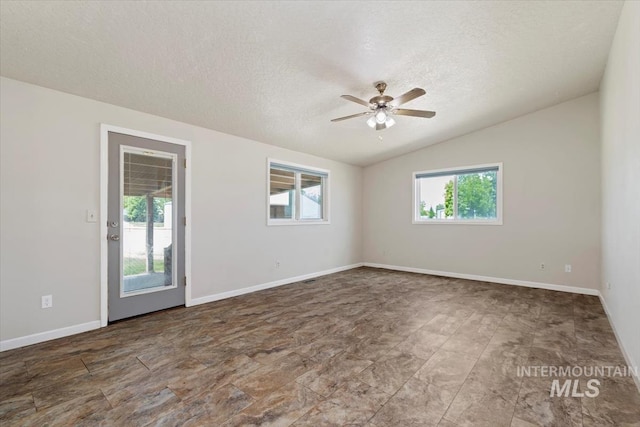 7267 Bowmont Rd, Nampa, ID 83686 - unfurnished room featuring ceiling fan, a textured ceiling, vaulted ceiling, and baseboards