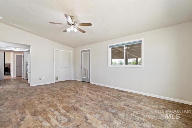 7267 Bowmont Rd, Nampa, ID 83686 - unfurnished room featuring lofted ceiling, a textured ceiling, ceiling fan, and baseboards
