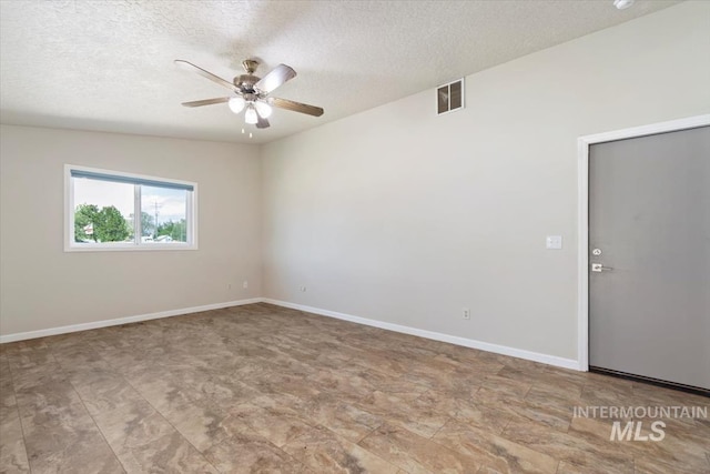 7267 Bowmont Rd, Nampa, ID 83686 - empty room featuring a ceiling fan, a textured ceiling, and baseboards
