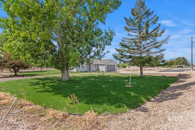 7267 Bowmont Rd, Nampa, ID 83686 - view of front facade featuring a front lawn and a garage