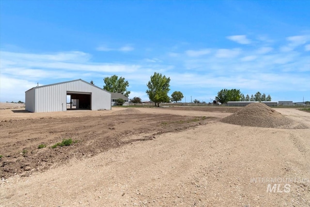 7267 Bowmont Rd, Nampa, ID 83686 - view of yard featuring a detached garage and an outbuilding