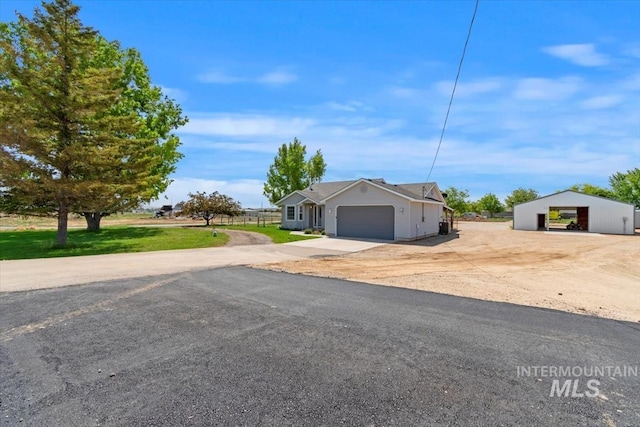 7267 Bowmont Rd, Nampa, ID 83686 - view of front facade with concrete driveway and a garage