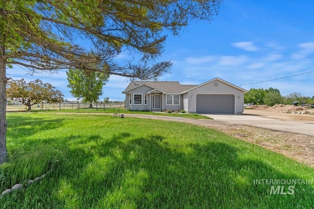 7267 Bowmont Rd, Nampa, ID 83686 - ranch-style house with concrete driveway and an attached garage