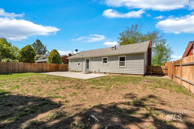 back of house with a patio