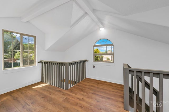 bonus room featuring wood finished floors and baseboards
