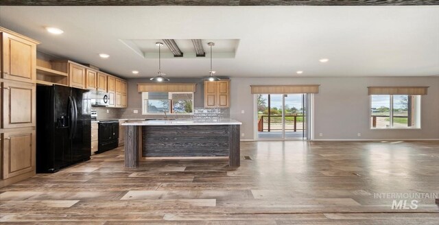 kitchen featuring black appliances, open shelves, wood finished floors, light countertops, and recessed lighting